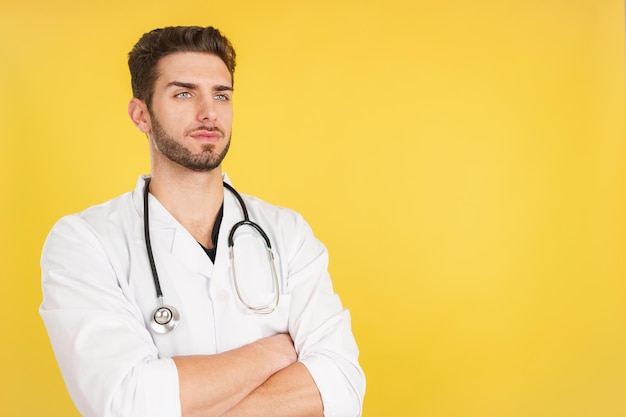 Serious doctor with arms crossed looking away