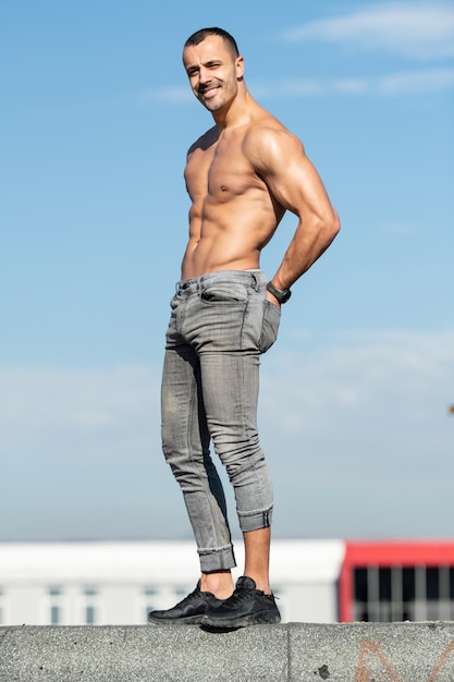 Serious Man Standing on Old Rooftop and Posing