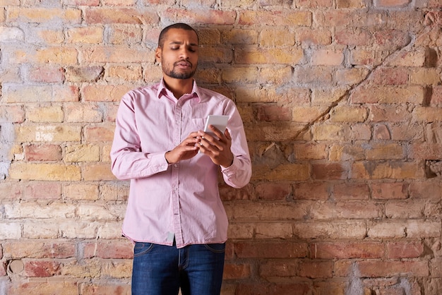 Serious man using smartphone