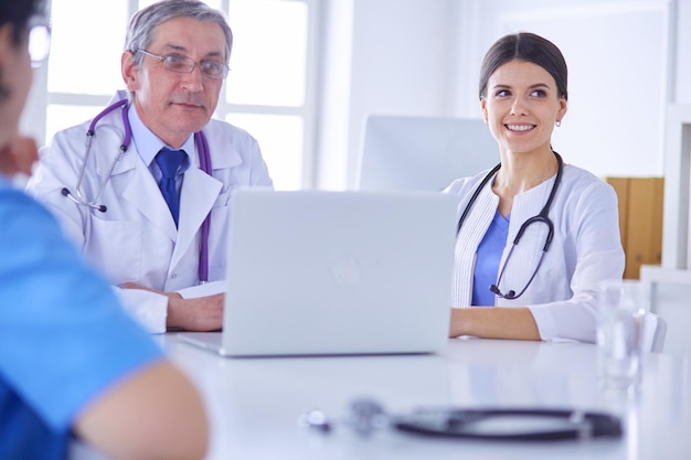 Serious medical team working in a bright office