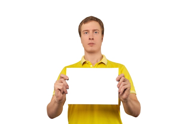 Serious nice guy holding blank paper sheet paper mockup isolated on white background