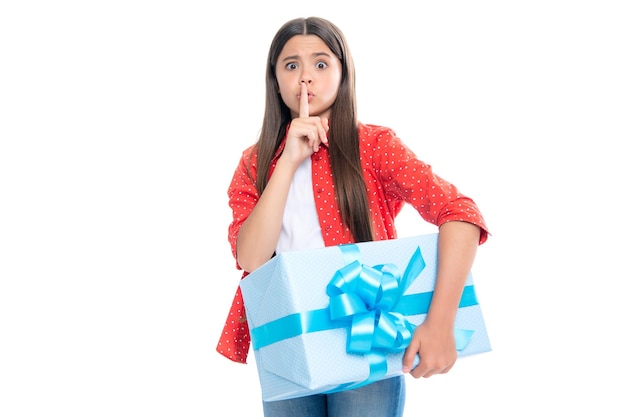 Serious teenager girl Child 12 13 14 years old with gift on isolated white background Birthday holiday concept Teenager hold present box