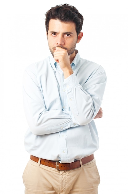 Serious young man on a white background