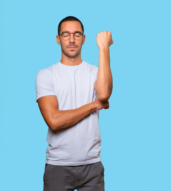 Serious young man with his fist up