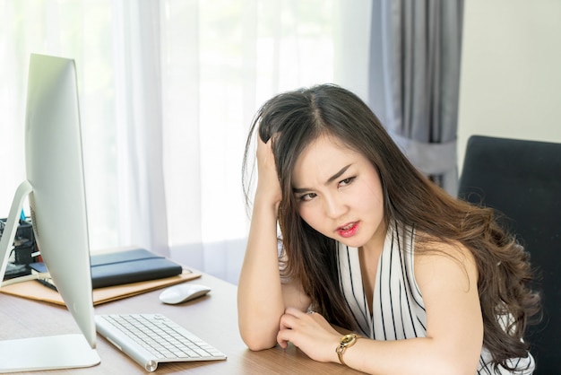 seriously asian woman in office 