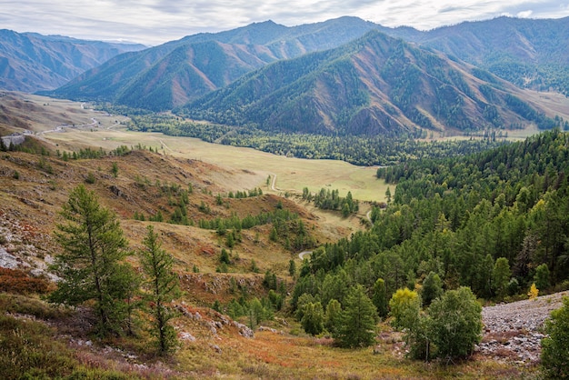 Serpentine mountain road. View of the Chuysky tract from the Chike-Taman pass, Altai mountains, Russia