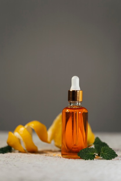 Serum in a glass bottle with a pipette. Essential oil for the care of women's skin.