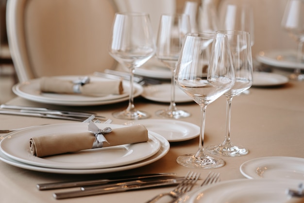 Served dinner table in a restaurant Restaurant interior table setting for a dinner