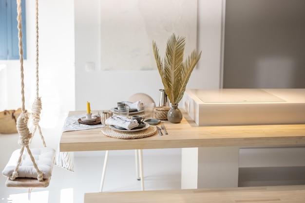 Served table for breakfast in a modern bright apartment