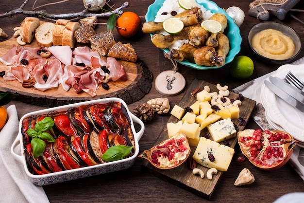 Served table with different food and snacks.