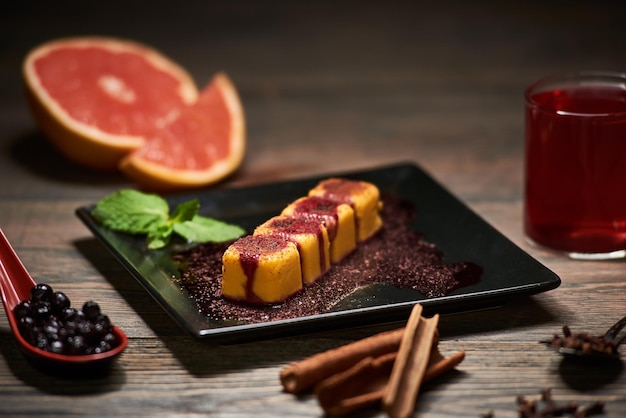 Serving sushi rolls and other traditional japanese and asian food on a table