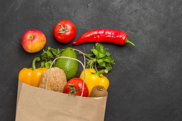 Set of balanced products for healthy diet. Paper bag with vegetables. Healthy lifestyle concept. Health food fitness.