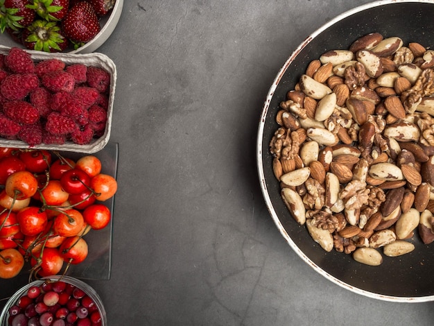 Set of berries nuts in bowls for a healthy lifestyle Healthy eating concept healthy heart food resveratrol and antioxidants