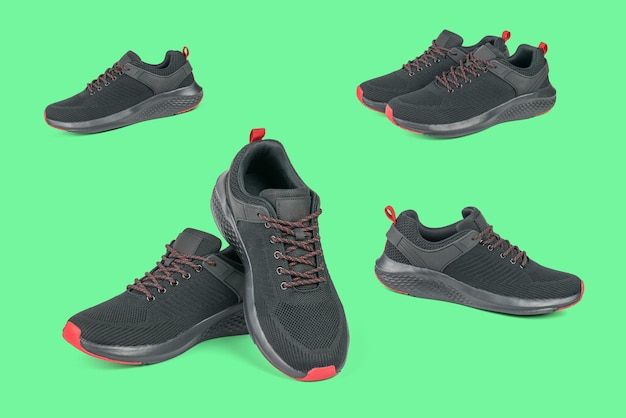 A set of black and red sneakers on a green background