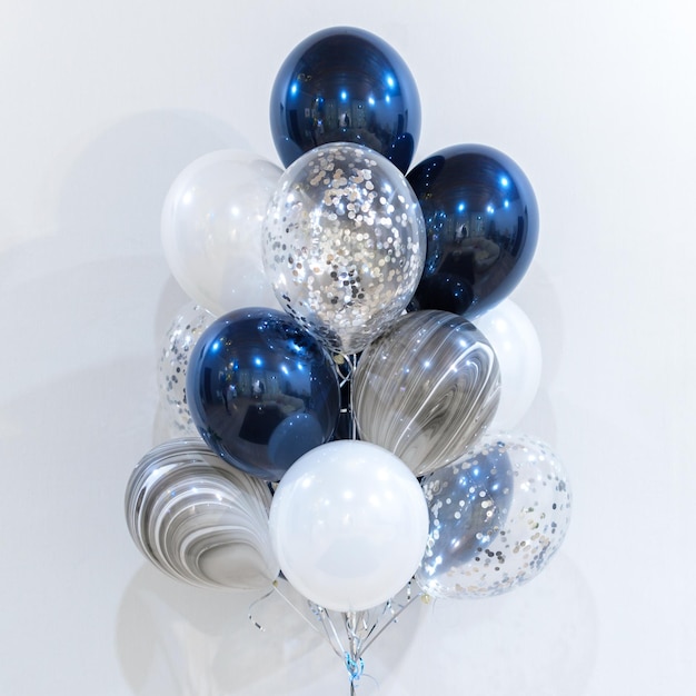 Set of blue and white foil helium balloons in form of stars Concept of holiday happy birthday