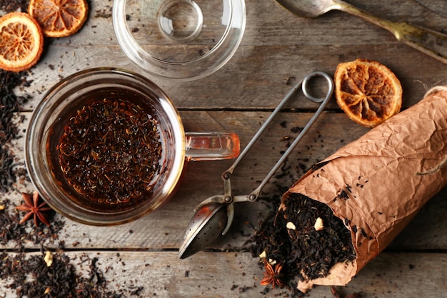 Photo set for brewing tea on wooden background