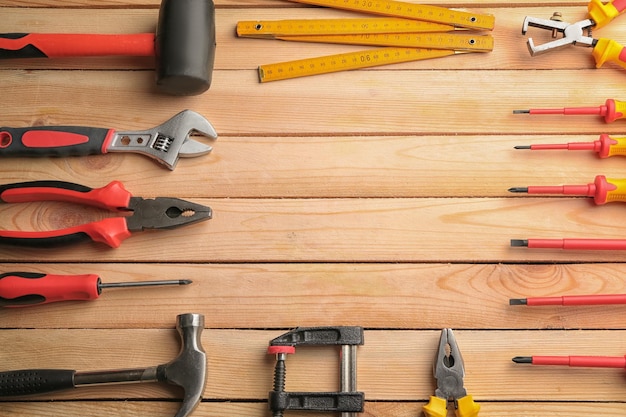 Set of carpenter's tools with place for text on wooden table