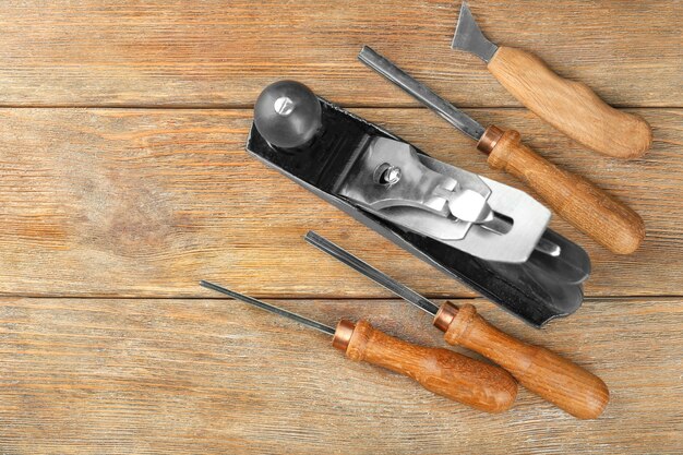 Photo set of carpenter's tools on wooden 