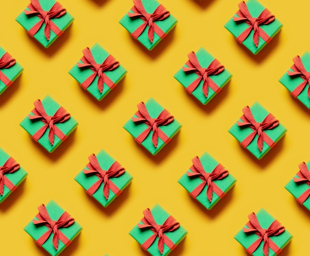 Set of Christmas gifts in a diagonal direction on a yellow background