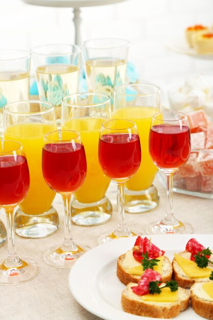 Set of cold snacks canape beverages closeup