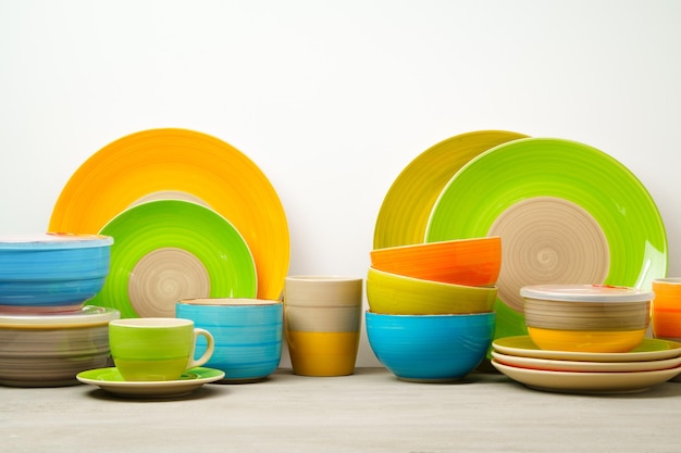 Set of colored ceramic dishware front view