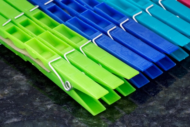 Set of colorful clothes pegs, aligned in geometric composition