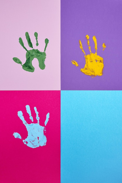 Set of colorful hand prints on different color background.