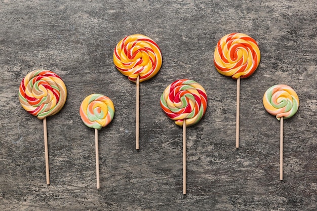 Set of colorful lollipops on colored background Summer concept Party Happy Birthday or Minimalist Concept