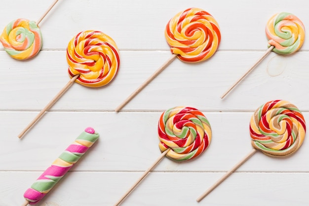 Set of colorful lollipops on colored background Summer concept Party Happy Birthday or Minimalist Concept