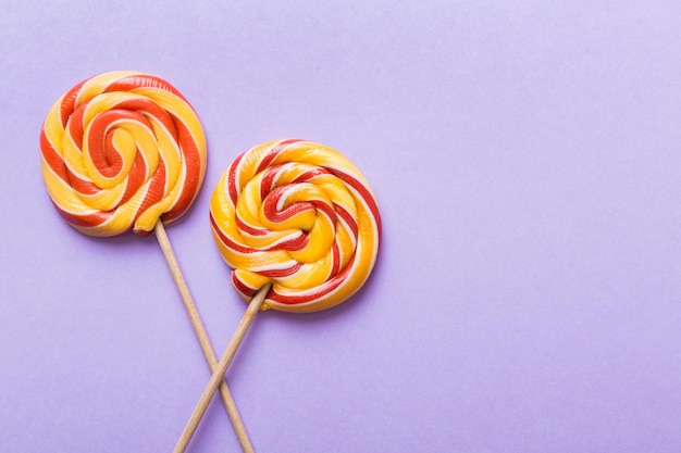 Set of colorful lollipops on colored background Summer concept Party Happy Birthday or Minimalist Concept