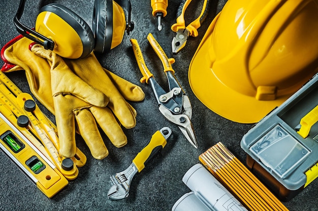 Set of construction tools on black background