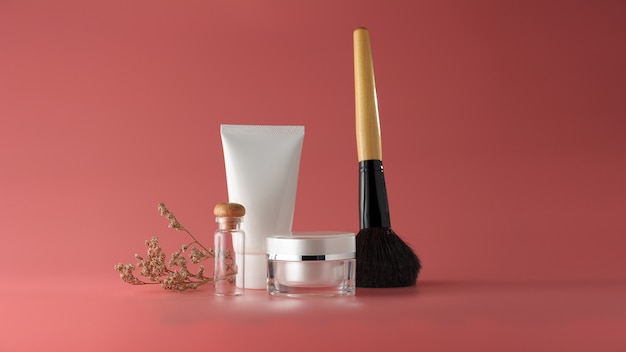 Set of cosmetic products on a color background.