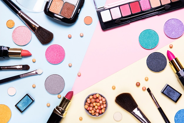 Set of decorative cosmetics on colorful background, top view