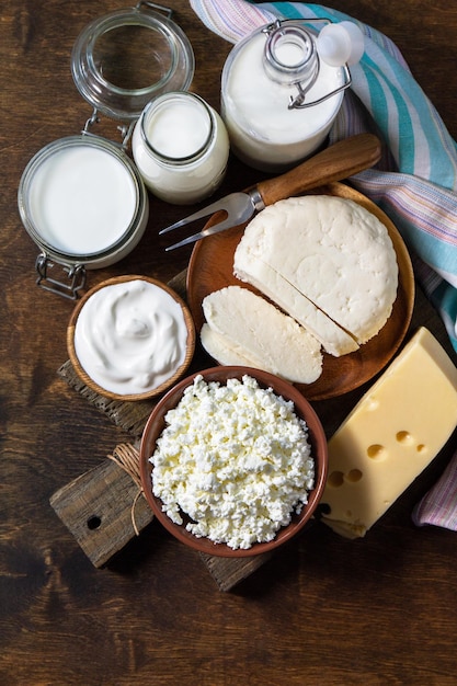 Set of different dairy organic products milk sour cream cottage cheese yogurt and butter Top view