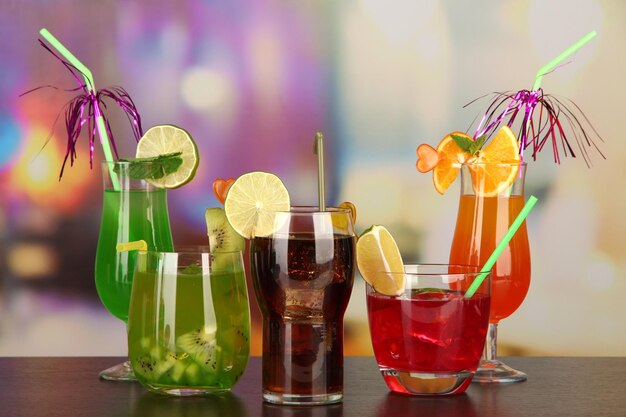 Set of different drinks on bright background