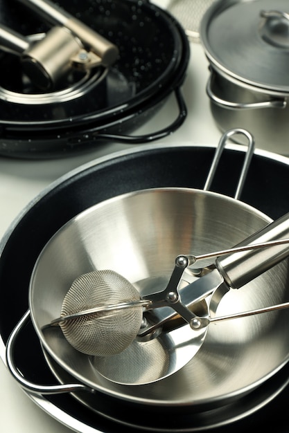 Set of different kitchen utensil on white background.