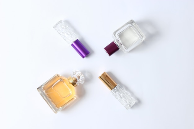 Set of different perfumes on a light background