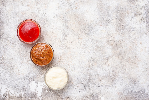 Set of different sauces: mustard, ketchup, mayonnaise