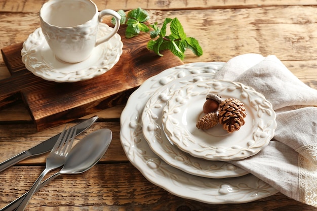 Set of dinnerware on wooden table