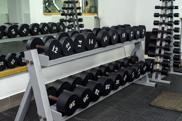 Set of dumbbells in sport gym