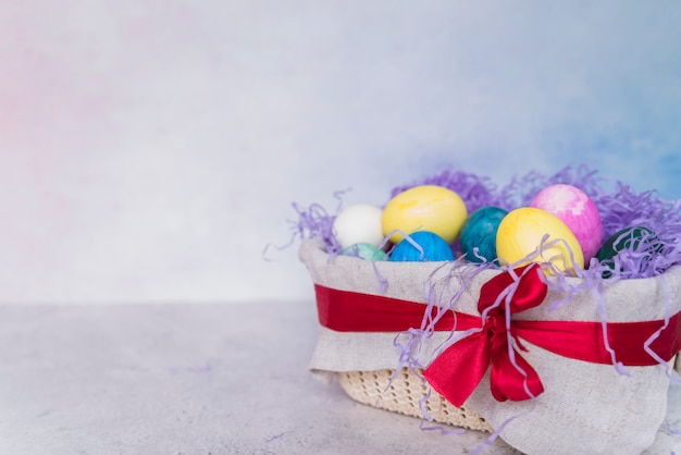 Set of Easter eggs in decorated basket