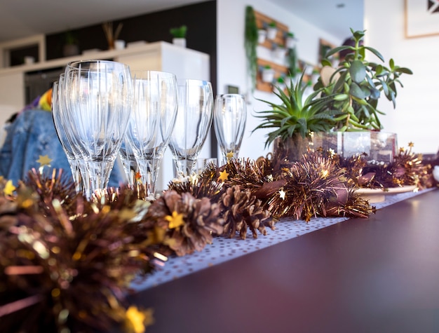 Set of empty wine glasses on a table against blurred background and rays of sun