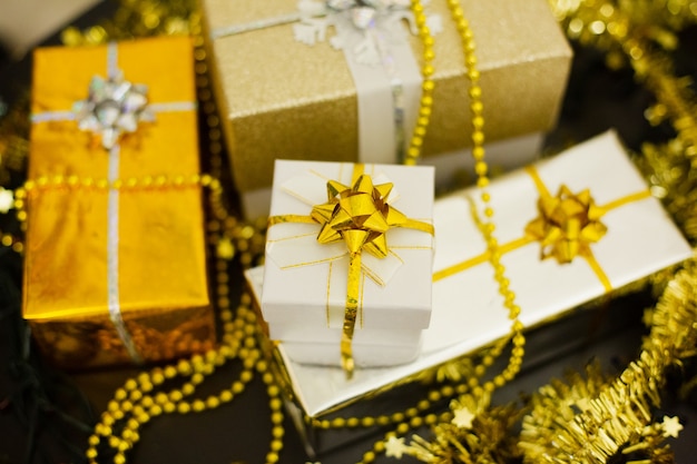 Set of festive multicolored Christmas gifts on the table, close-up.