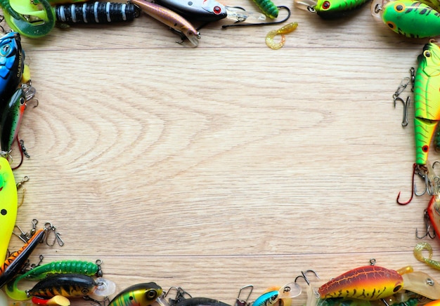 Set of fishing lures banner on a wooden light background