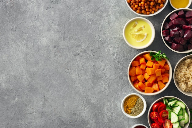 Set food for cooking healthy vegetarian food. Spiced chickpeas, baked pumpkin and beets, quinoa and vegetables.