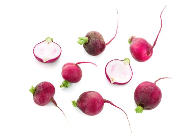 Set of fresh whole and sliced radish isolated. Top view