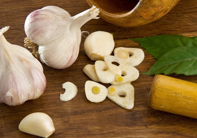 Set of garlic nutrition and healthy food on wooden texture