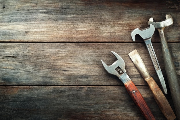 Set of hand tools on wooden background