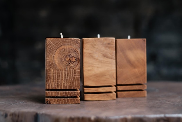 A set of handmade brown wooden candlesticks