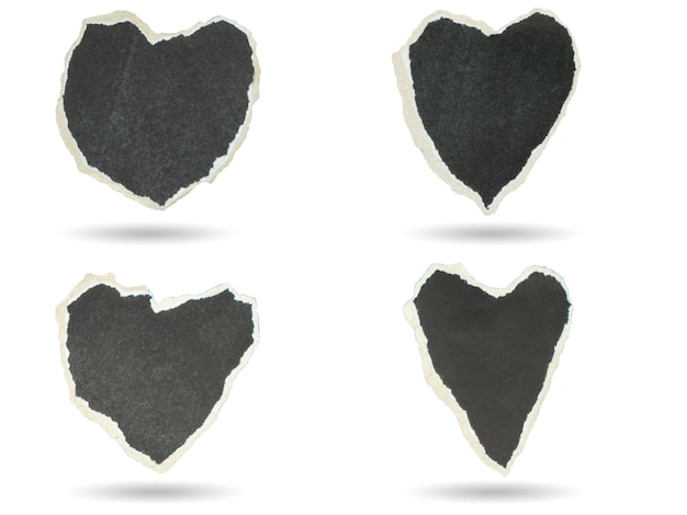 Set of heartshaped torn black paper 4 designs with gray shadows underneath white background